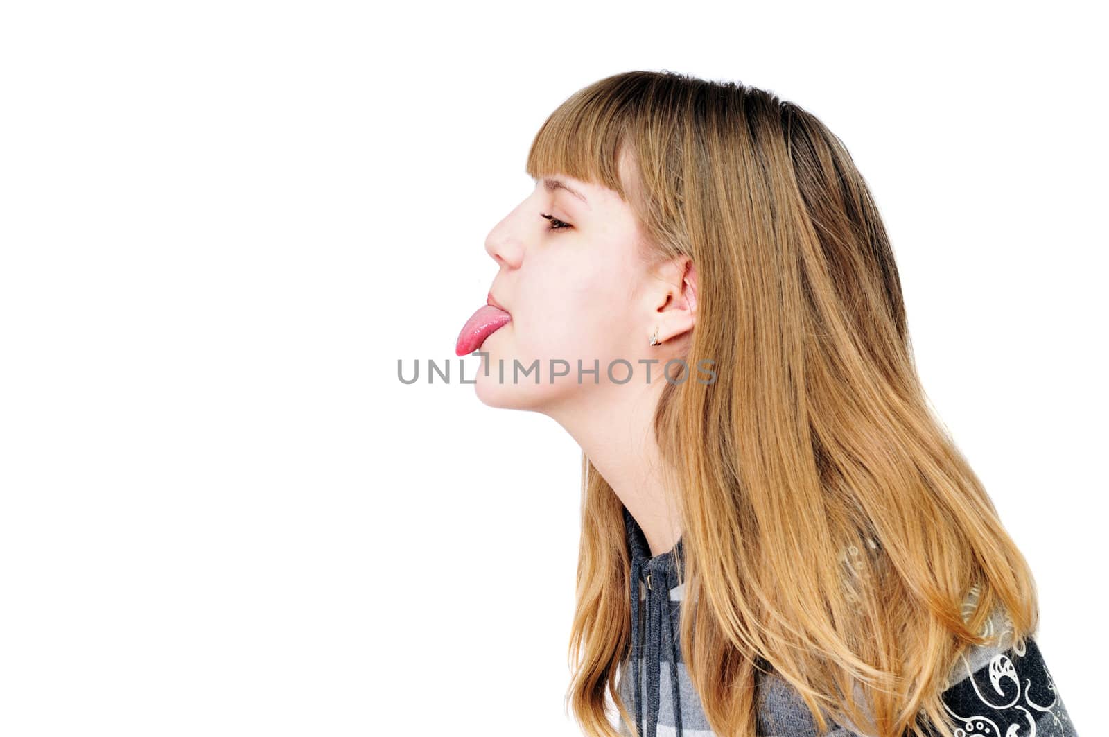   funny teen girl showing her tongue out

