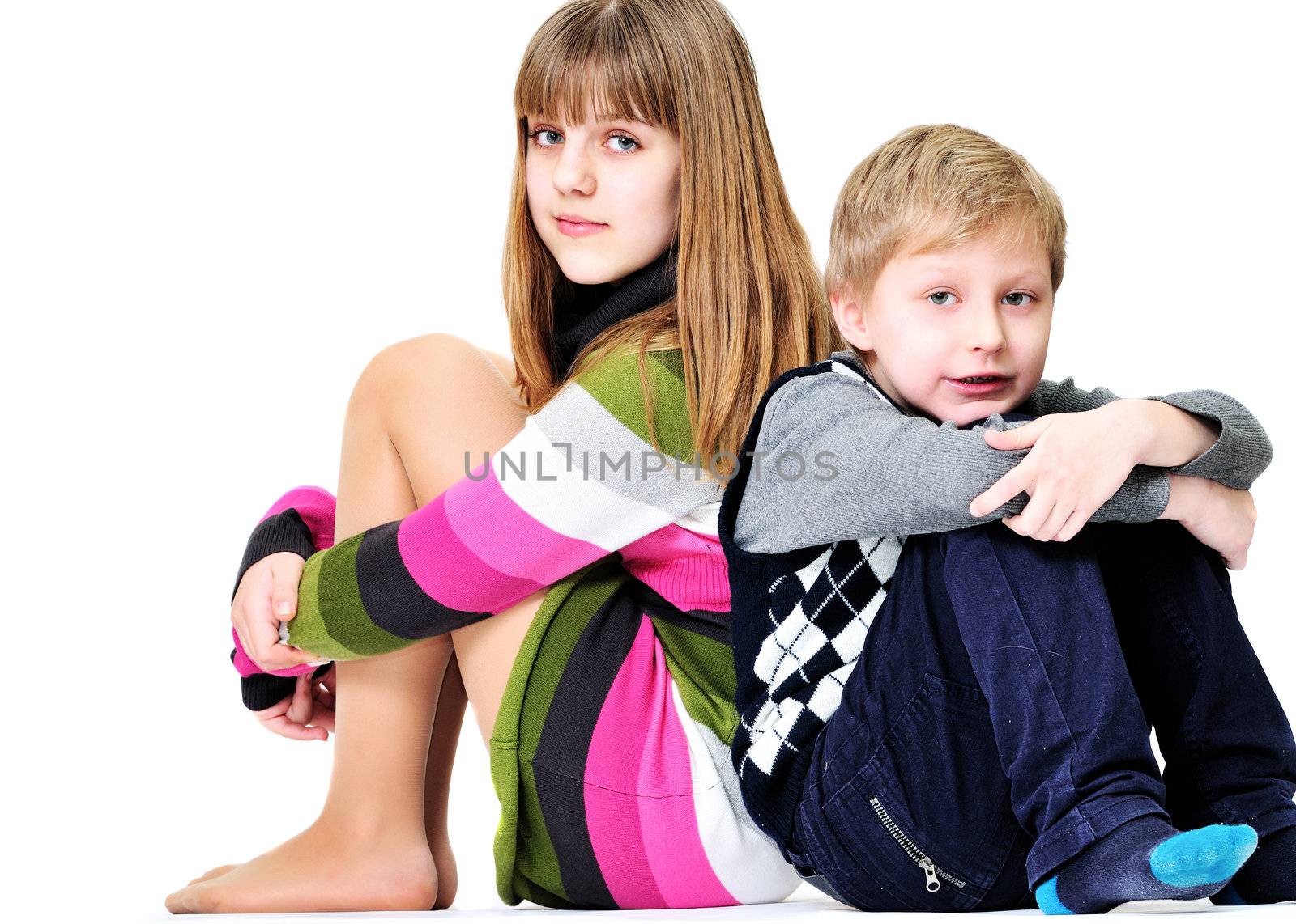 brother and sister sitting on the white background