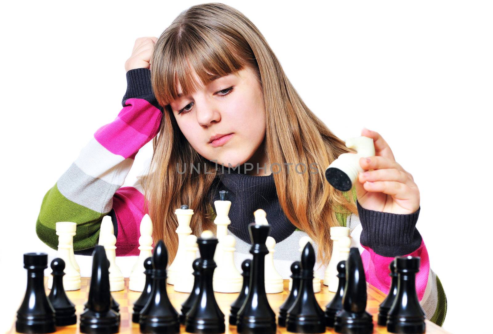   Young teen girl thinking with chess in hand