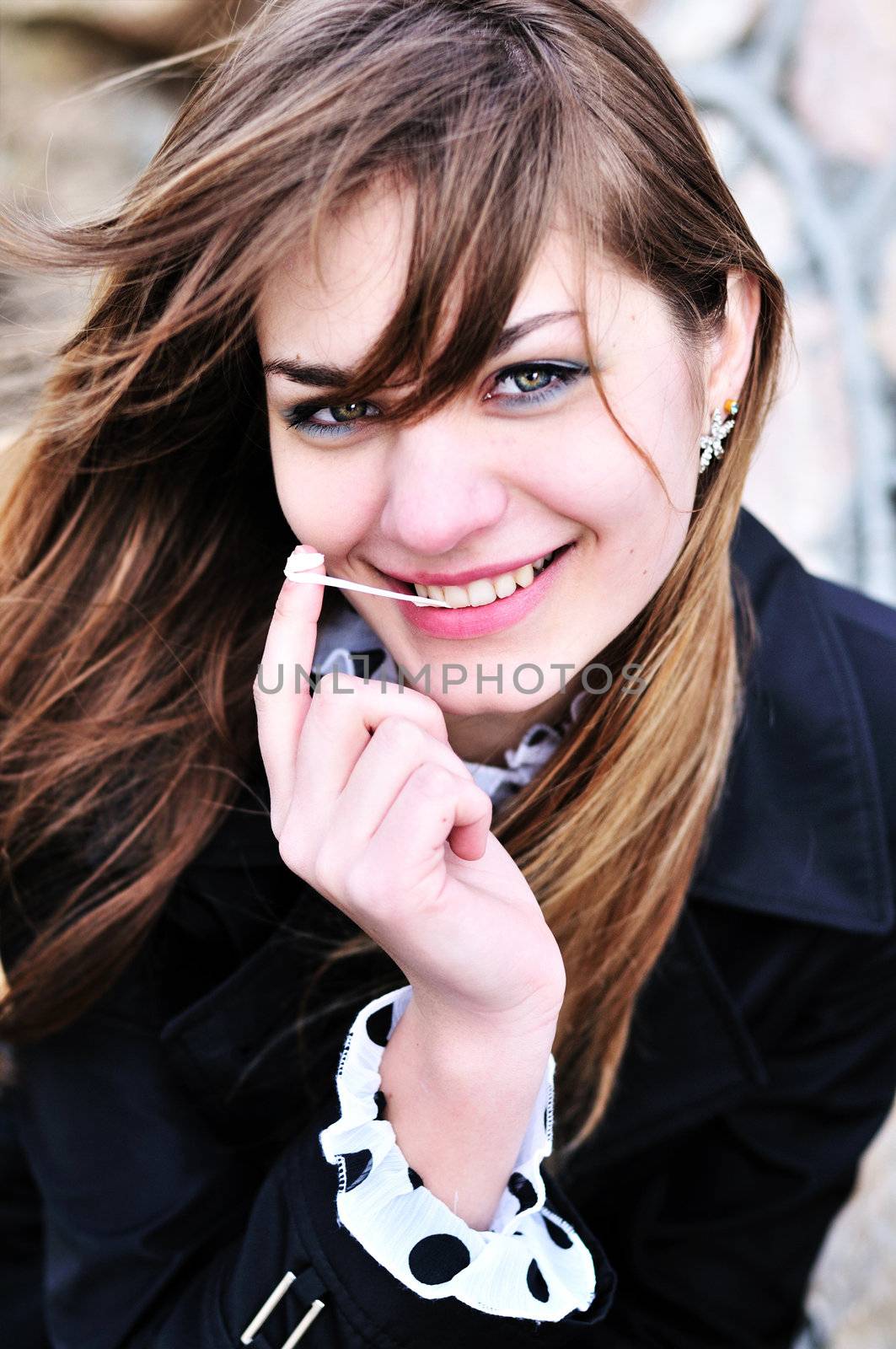 portrait of sweet teen girl with chewing gum