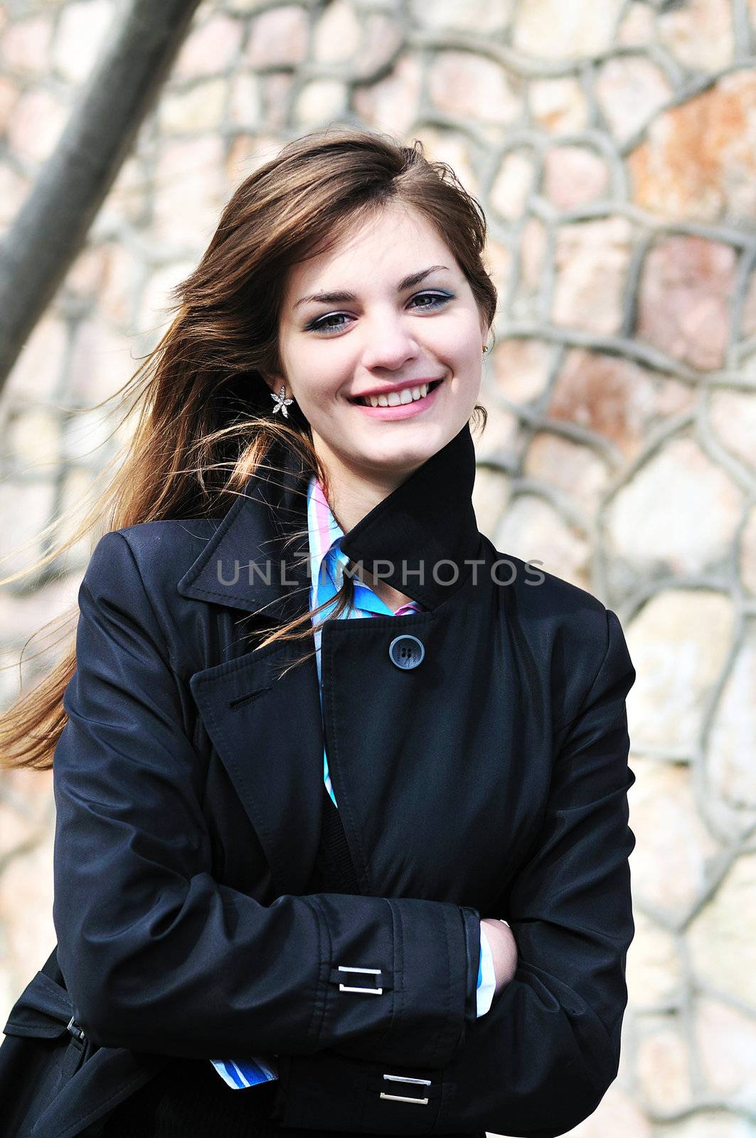  portrait of smiling teen girl outdoors in spring time
