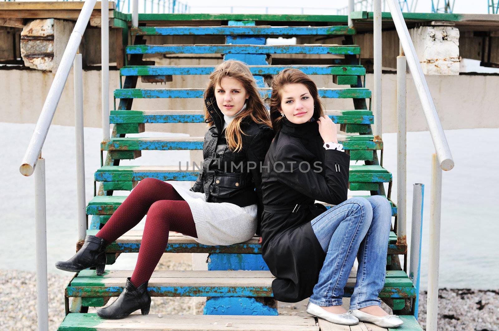  girls sitting on  the stairs by Reana