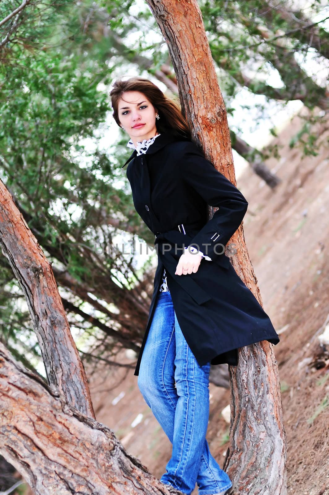   portrait of lovely teen girl near the tree

