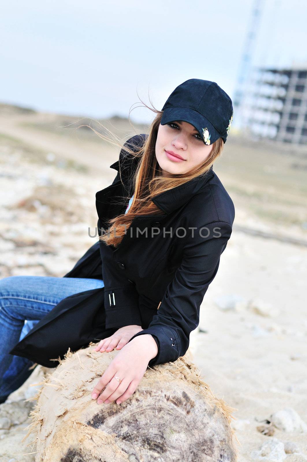  girl  sitting on the log by Reana