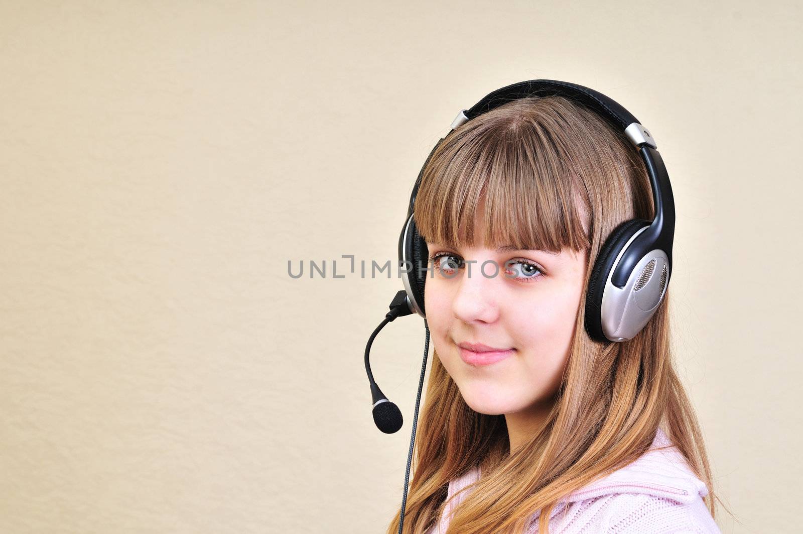 teenage girl in headphones chatting with friend
