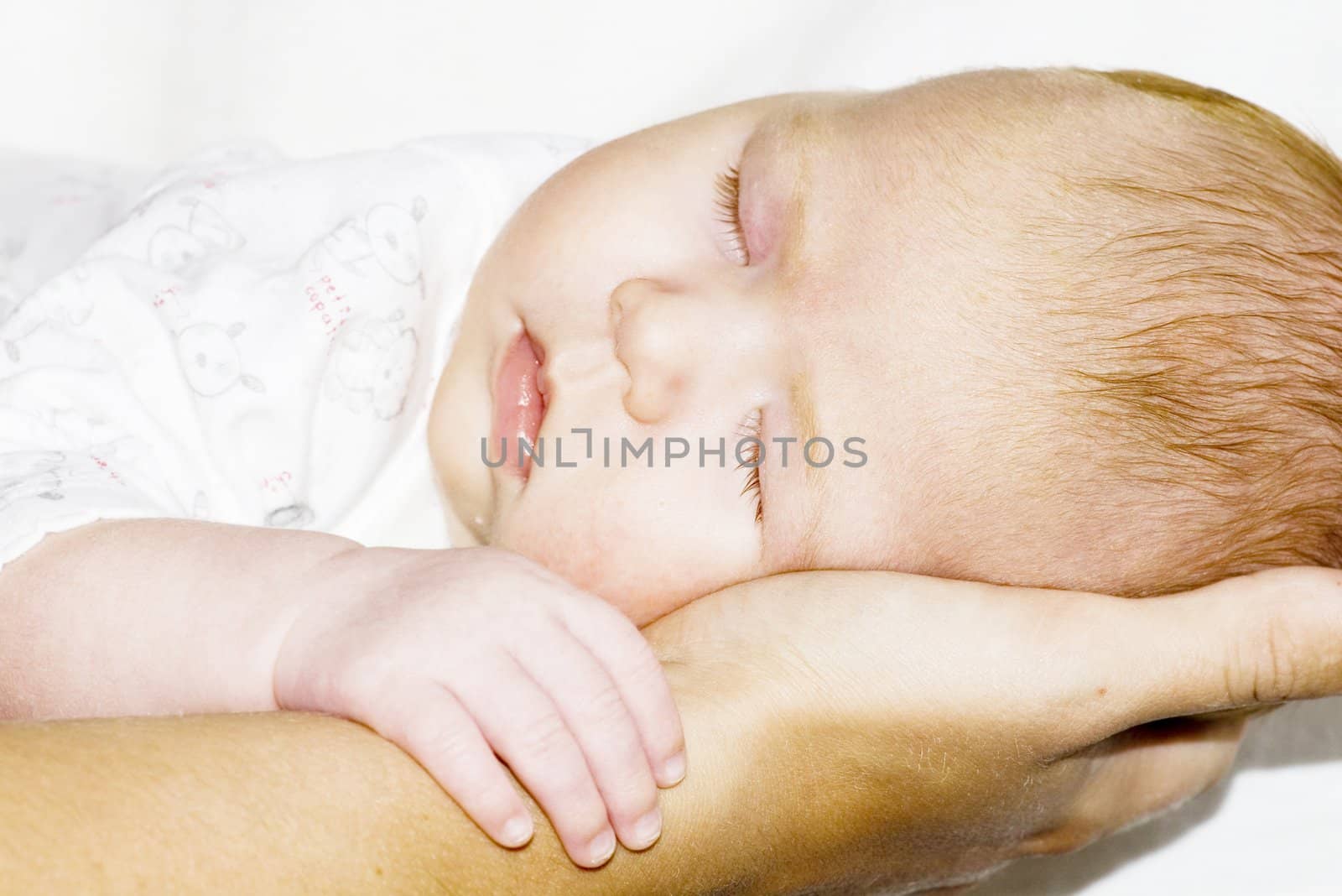 Sleep Baby on a mother hands by dolnikow