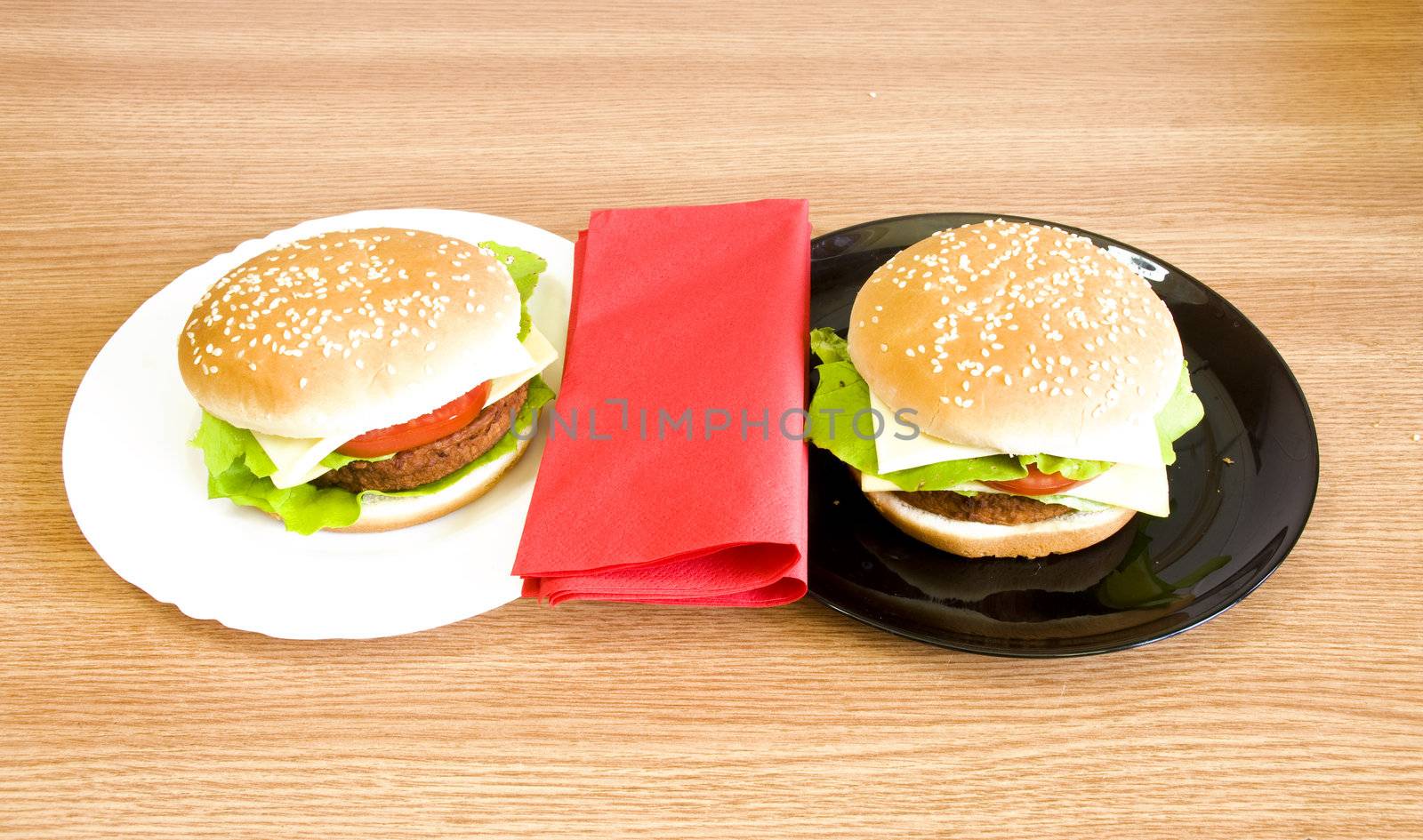 black and whote plates with hamburgers