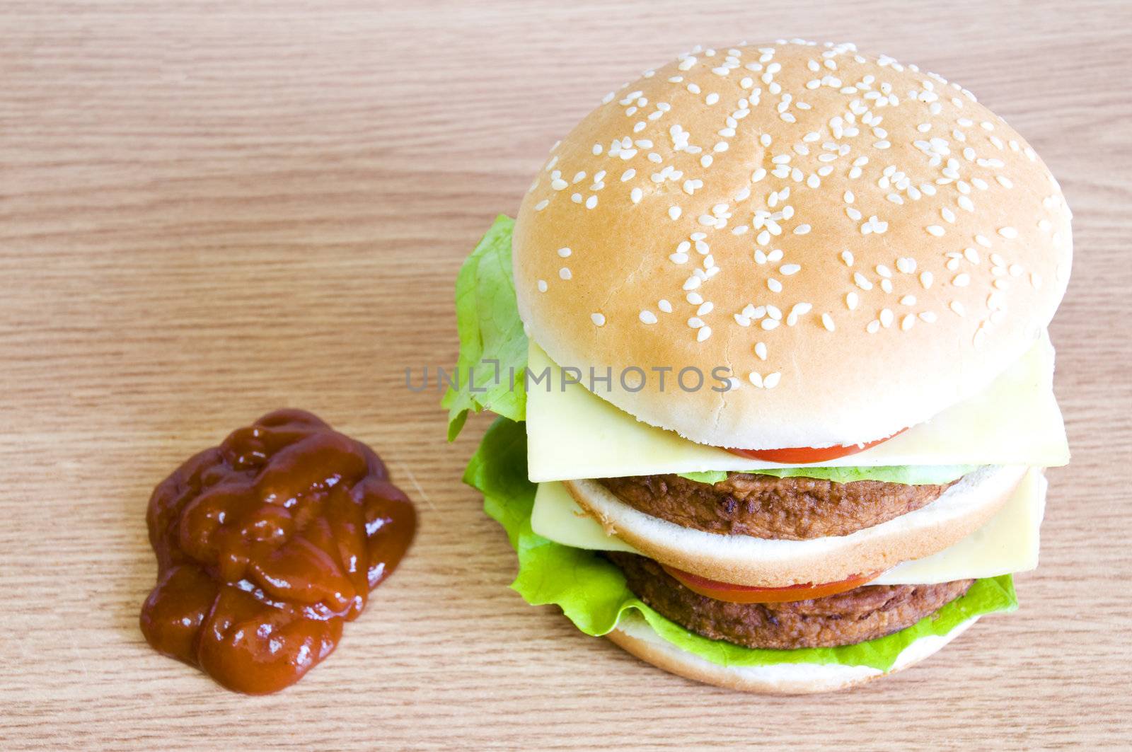 hamburger and ketchup, on light wood background