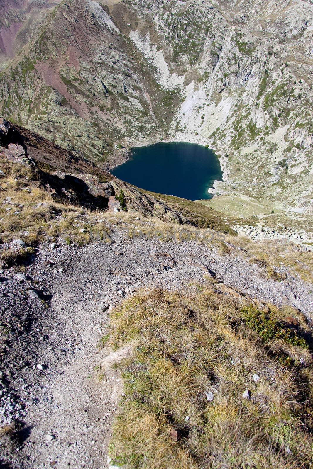 Path to big lake in Aiguestortes National Park. Aerial view on lake.