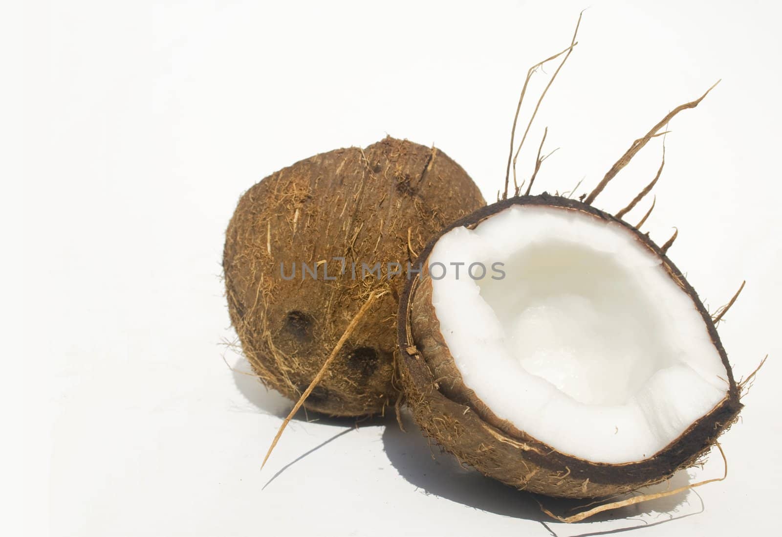 Broken coconut isolated on white