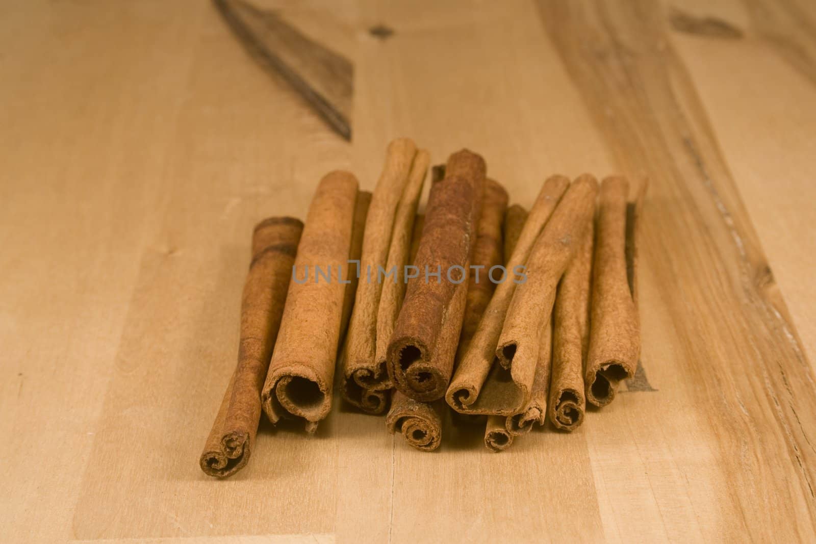 Cinnamon sticks on wood