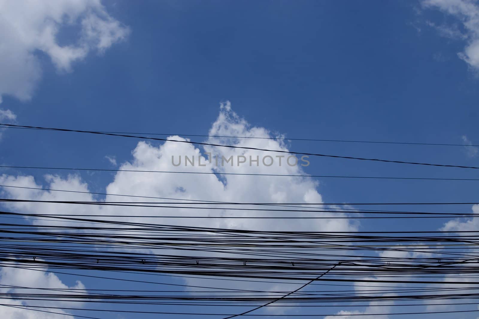 internet city cables on sky and clouds background