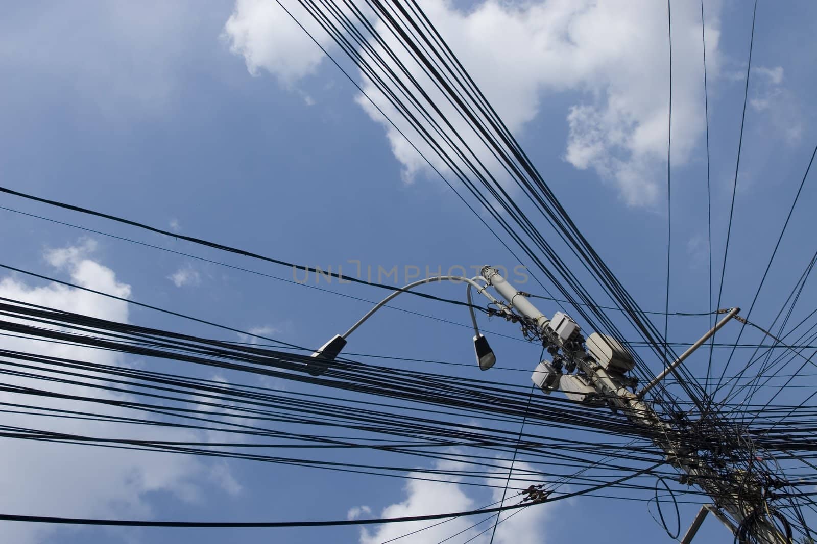 internet city cables on sky and clouds background