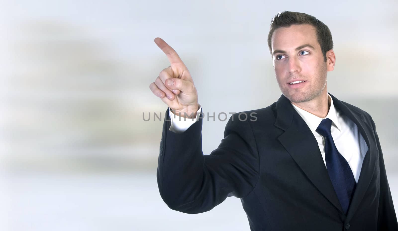 businessman pointing on an abstract background