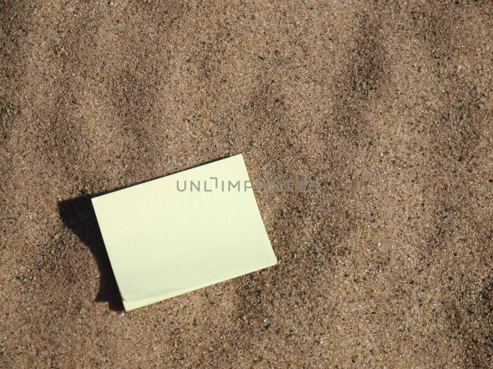 Notebook for records on sand on coast of lake     