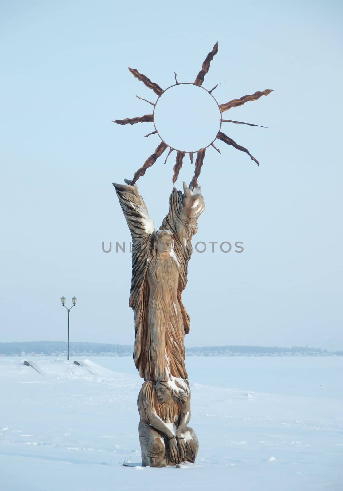 A wooden sculpture figure on quay of Onega in Petrozavodsk, Russia       
