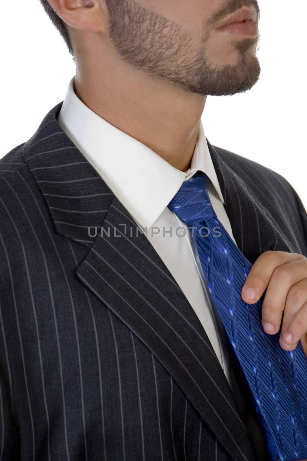 executive holding his tie on an isolated white  background