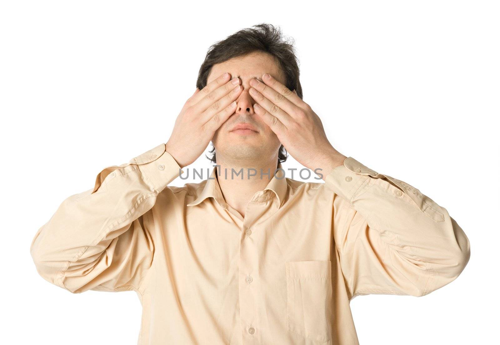 A man covering his eyes with his hands