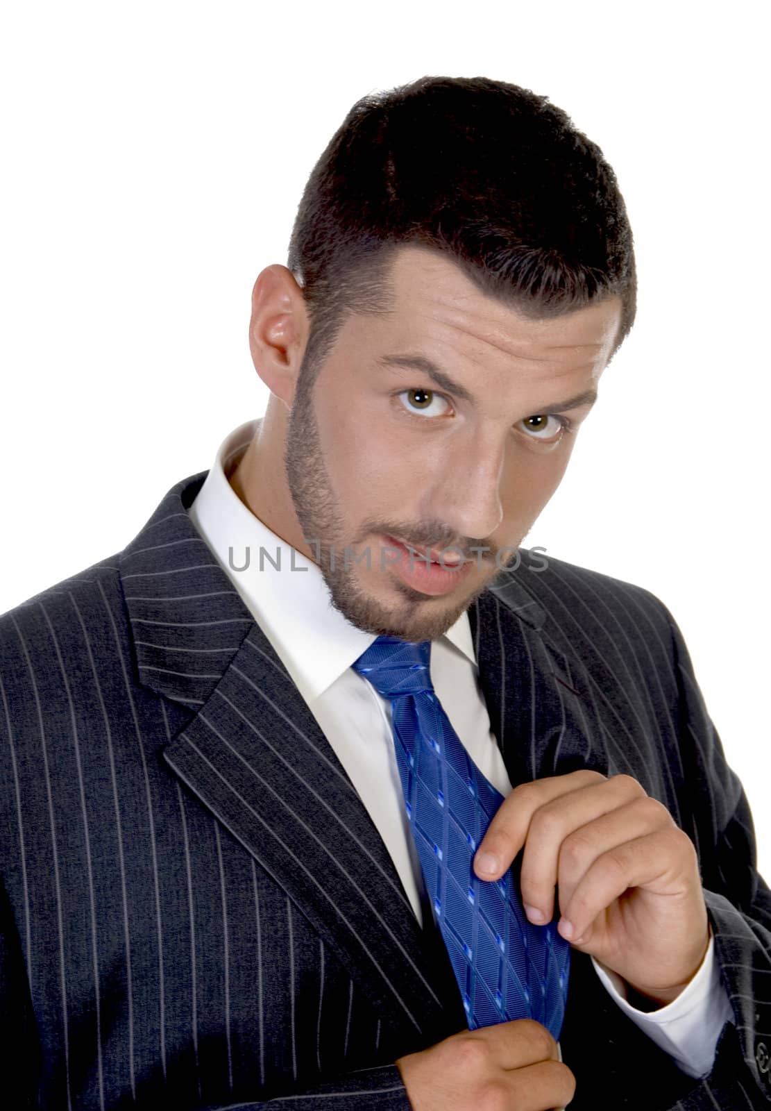 businessman holding his tie on an isolated background