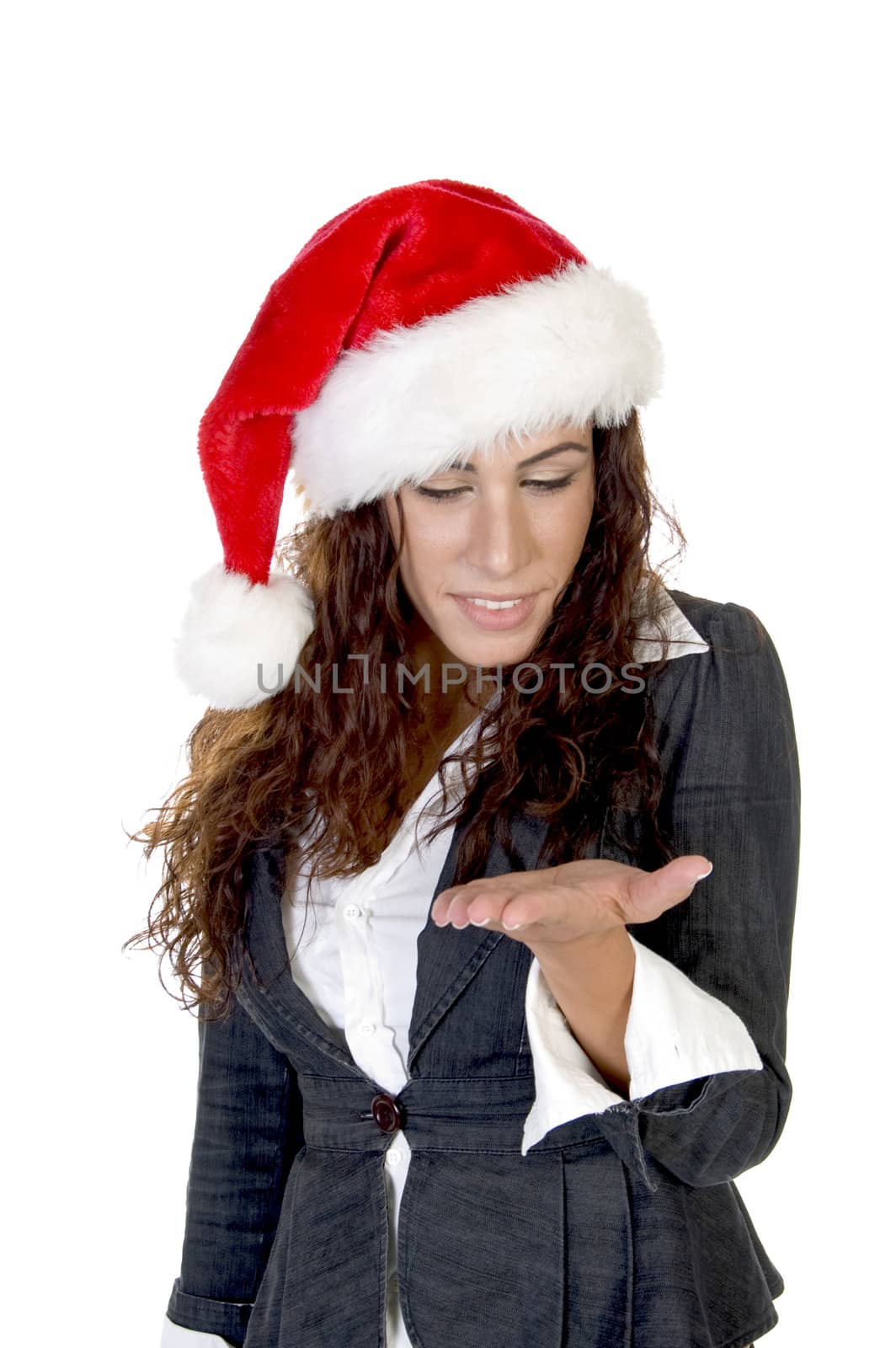 lady in christmas cap looking her palm on an isolated background