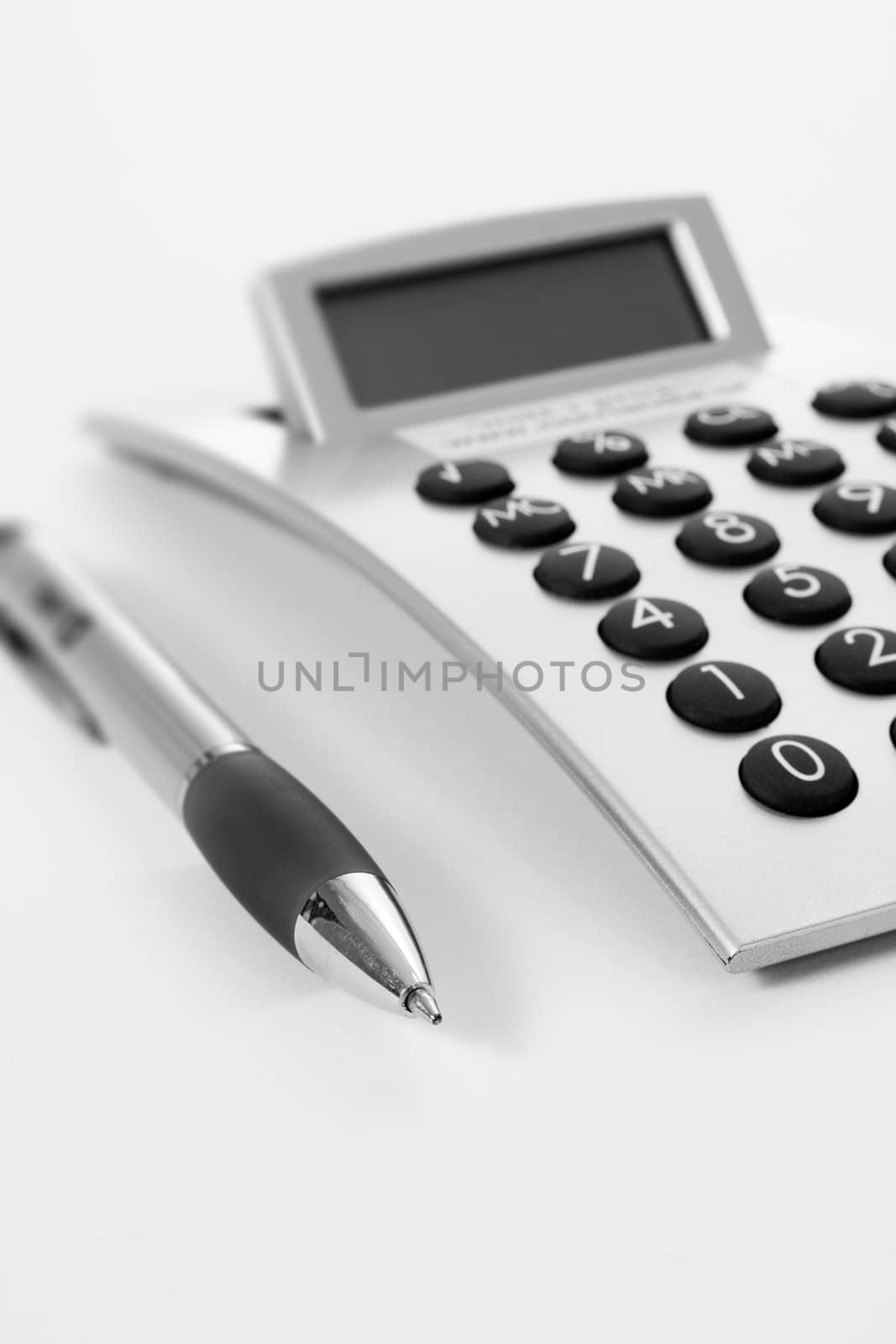 Pen and calculator (business background)