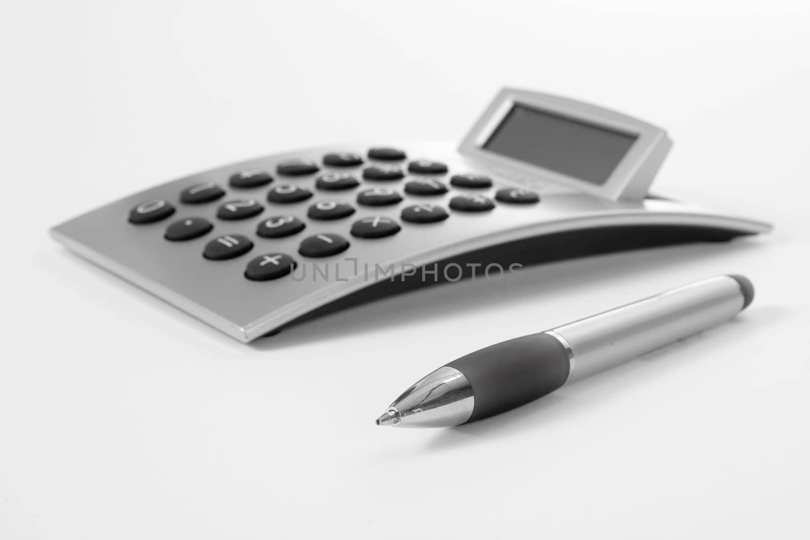 Pen and calculator (business background)