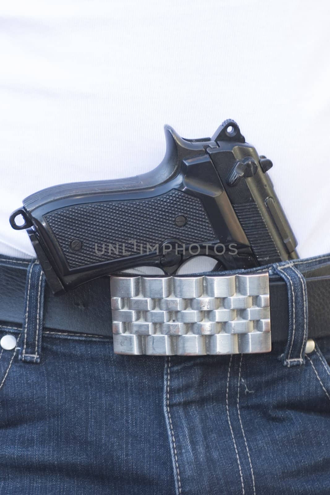handgun in pants, white shirt