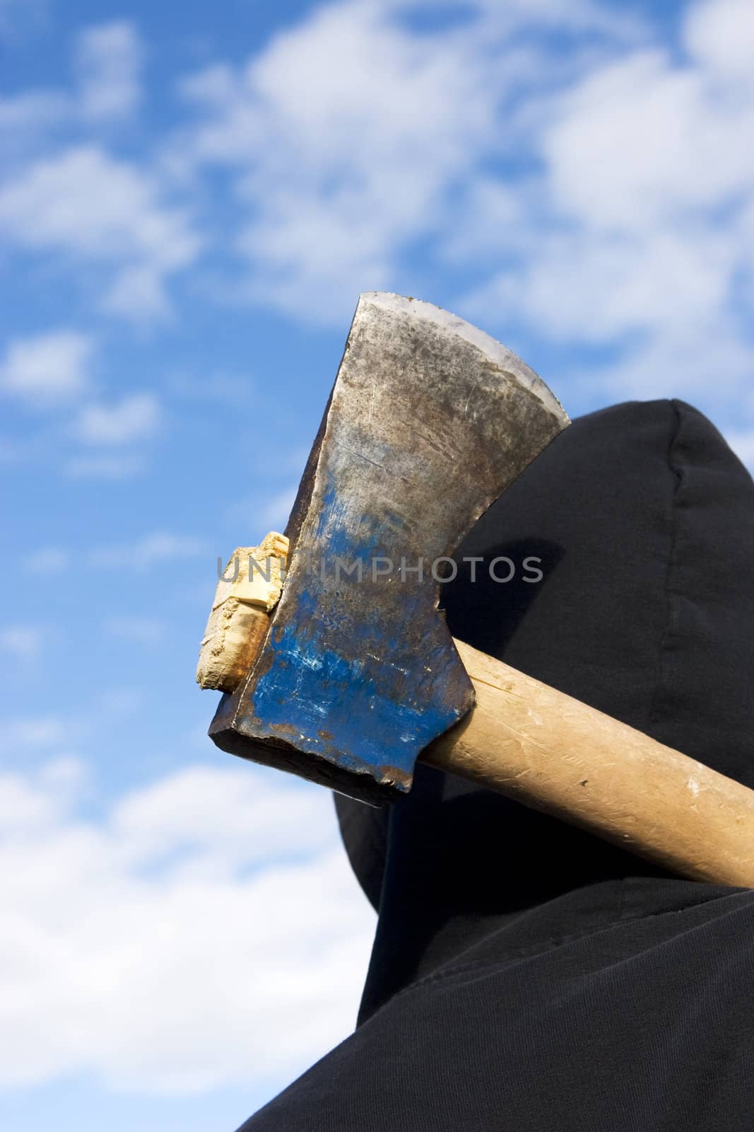 man with an axe on sky background