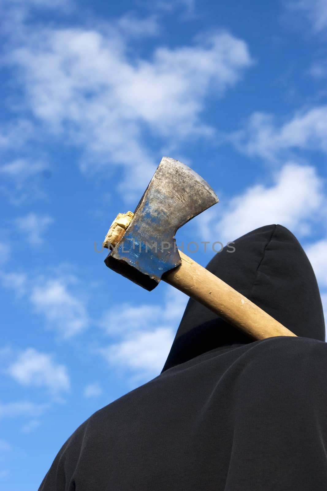 man with an axe on sky background