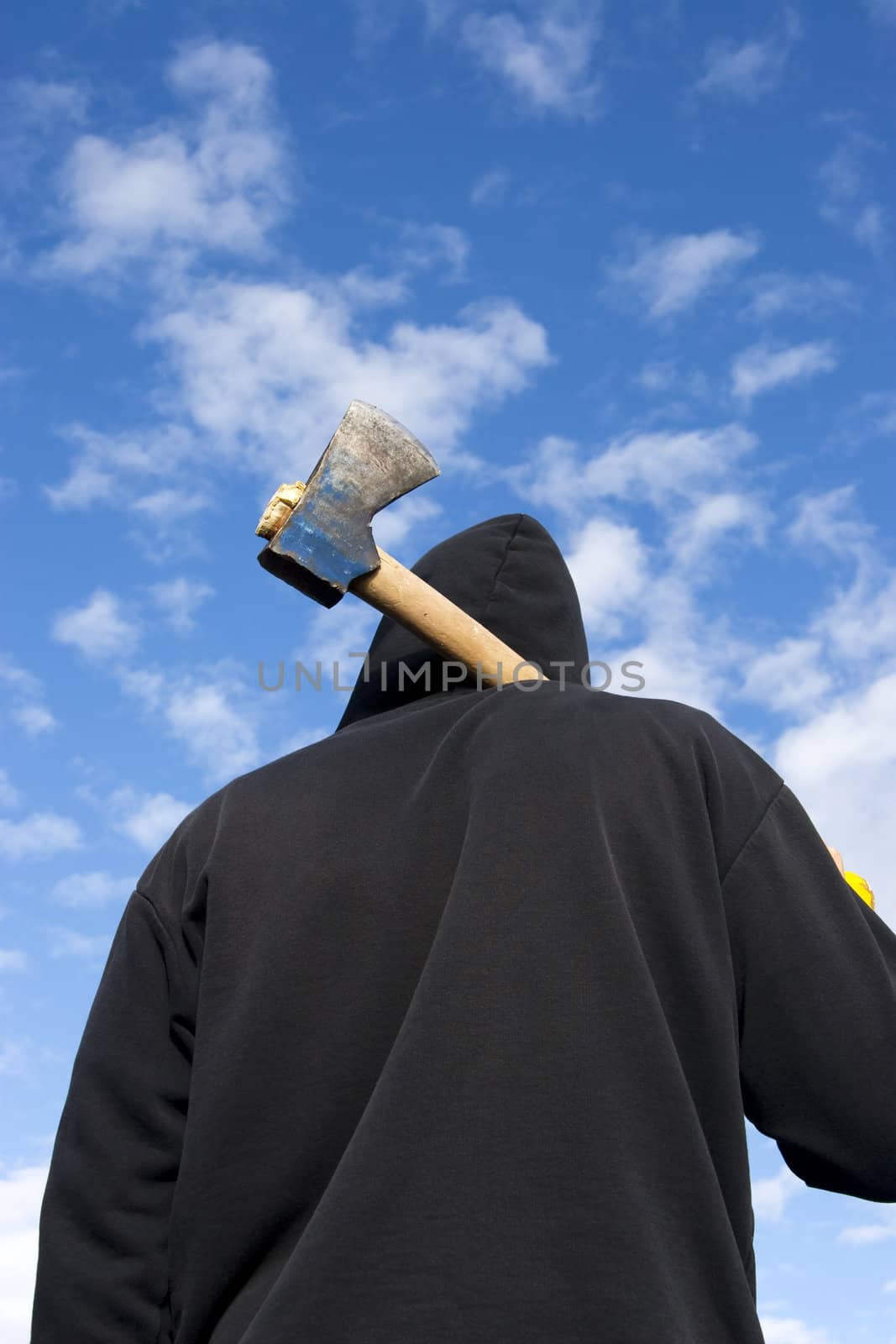 man with an axe on sky background