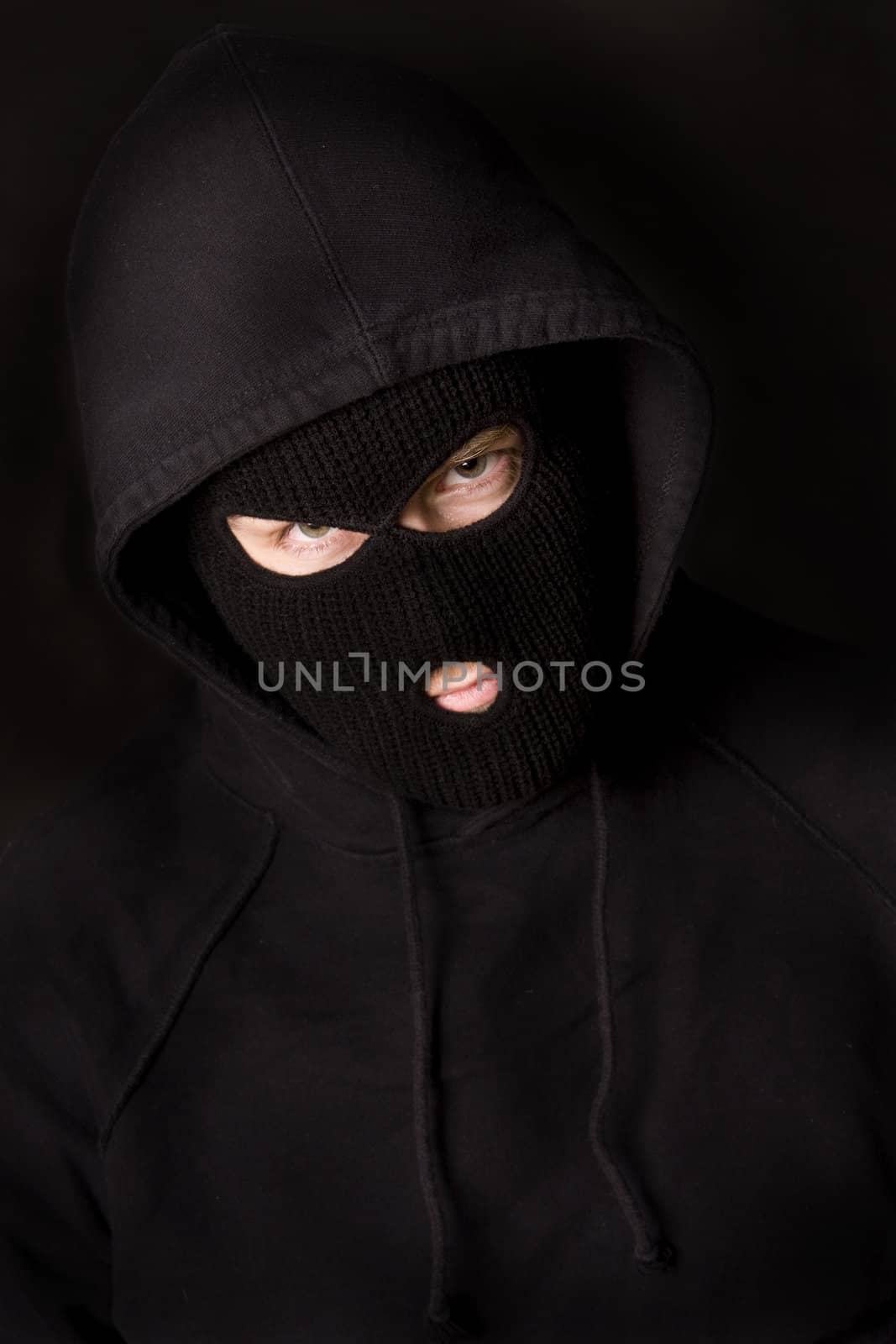evil criminal wearing balaclava