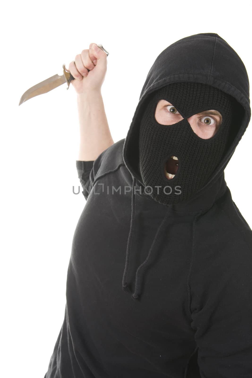 evil criminal wearing balaclava with a knife