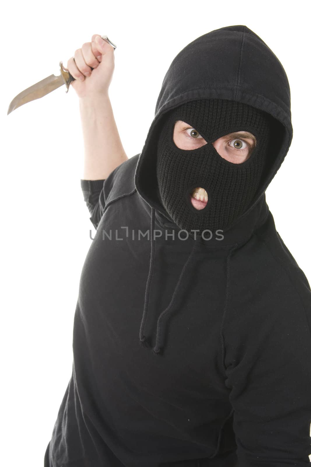 evil criminal wearing balaclava with a knife