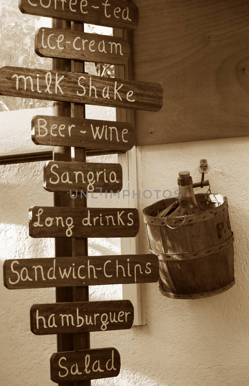 The outdoor wooden menu of a bar