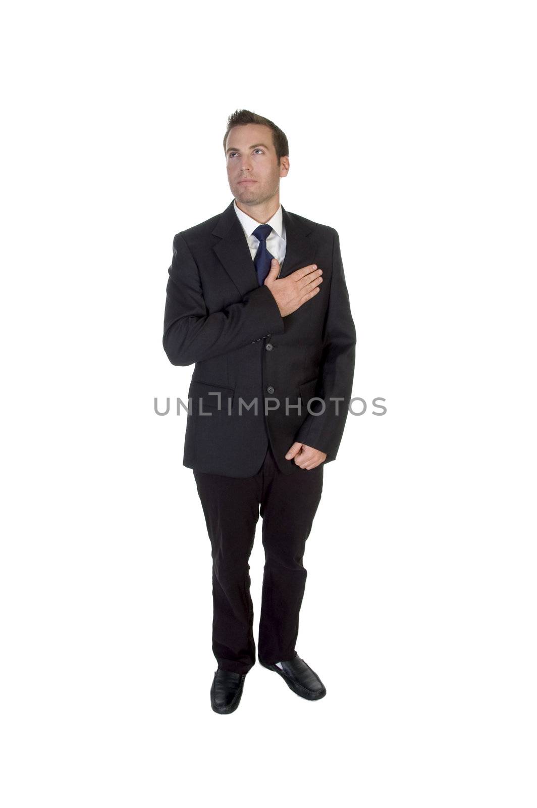 standing businessman saluting by heart on an isolated background