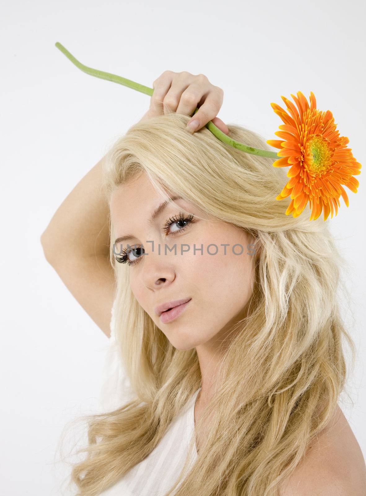 pretty young lady holding orange gerbera isolated with white background