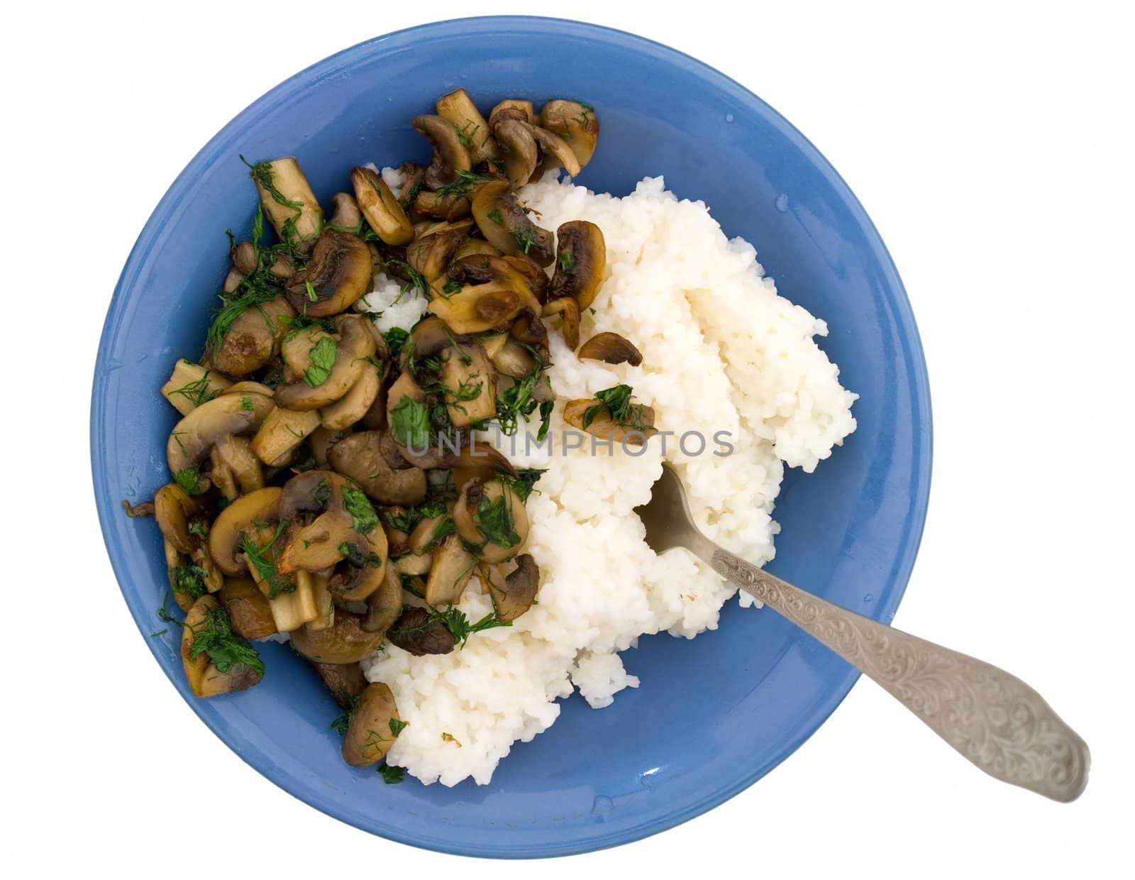 Champignons and rice on a blue plate on a white background.