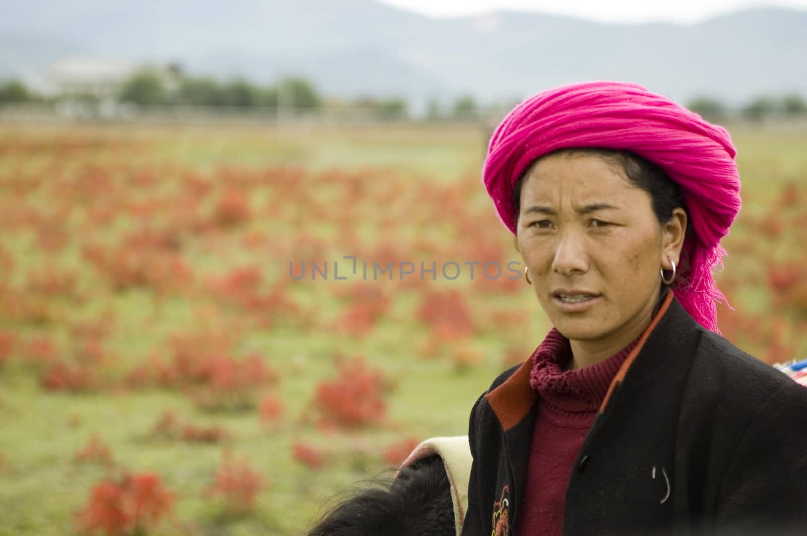 China, Yunnan province, Shangrila city. Nomad woman portrait.