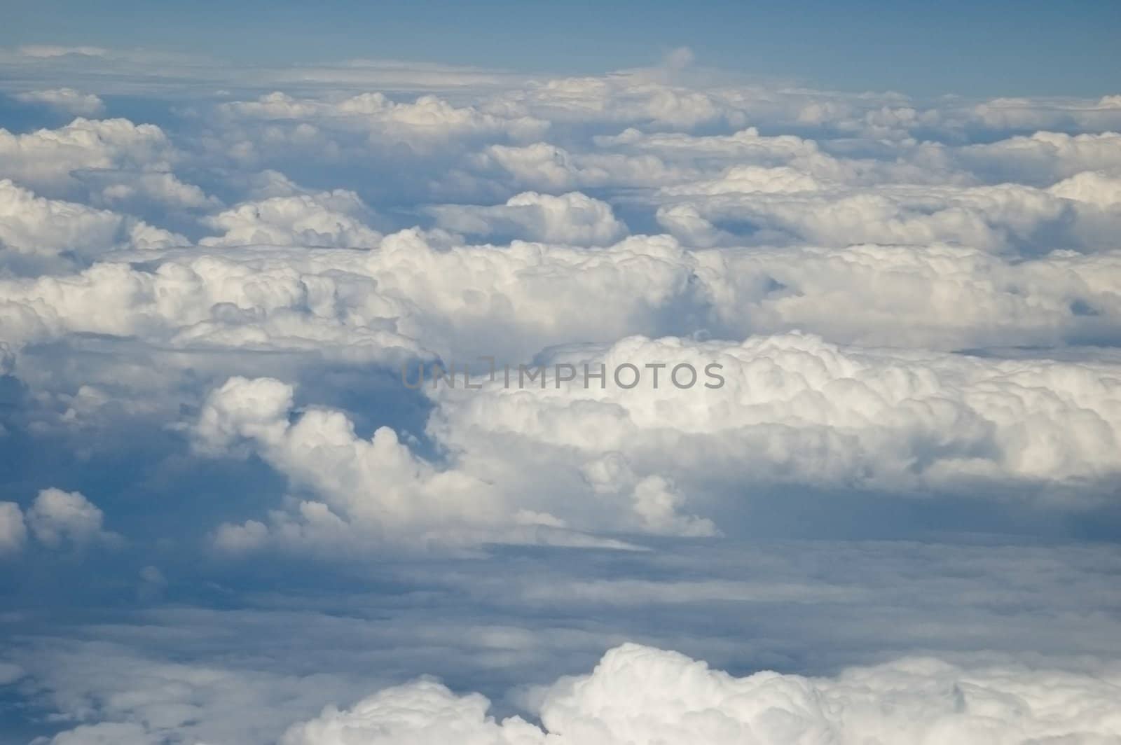 Beautiful blue sky with white clouds covering sky somewhere above China.