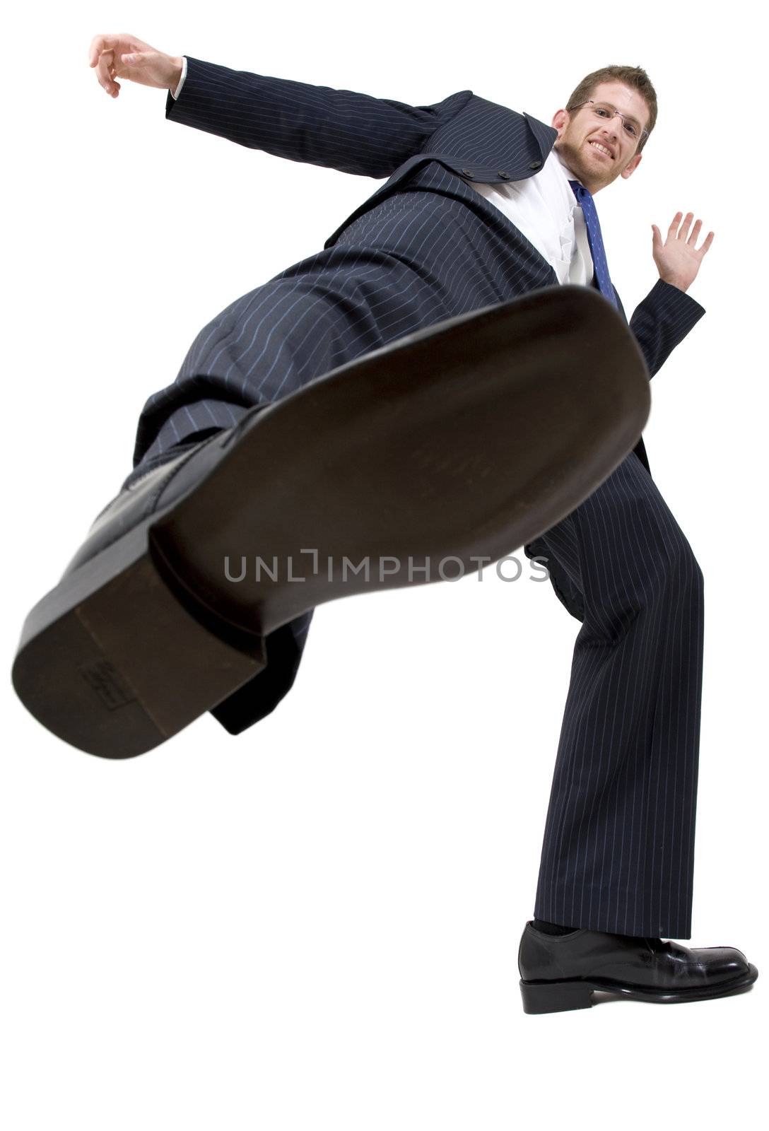 businessman kicking on isolated background