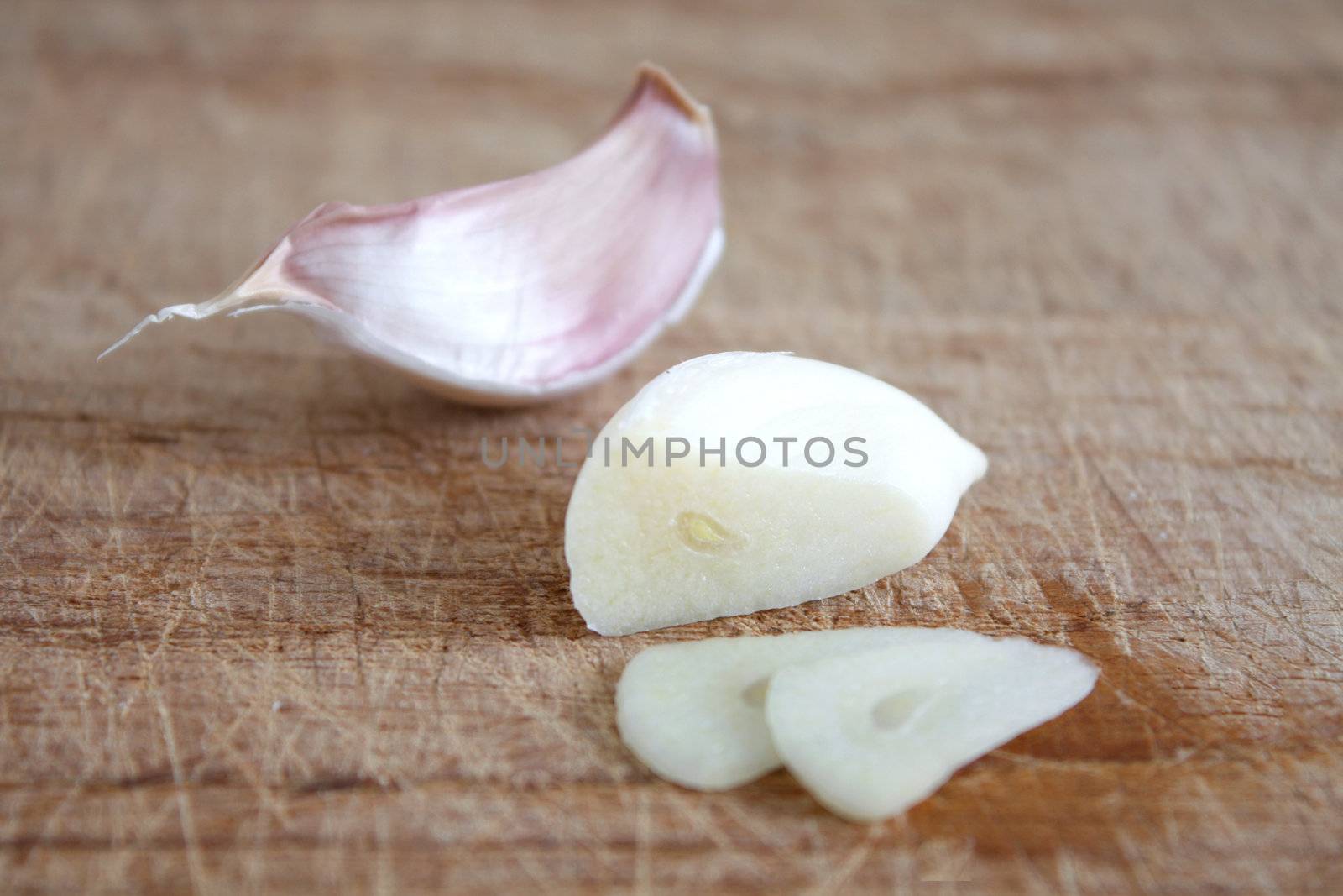 Fresh garlic on a wooden background