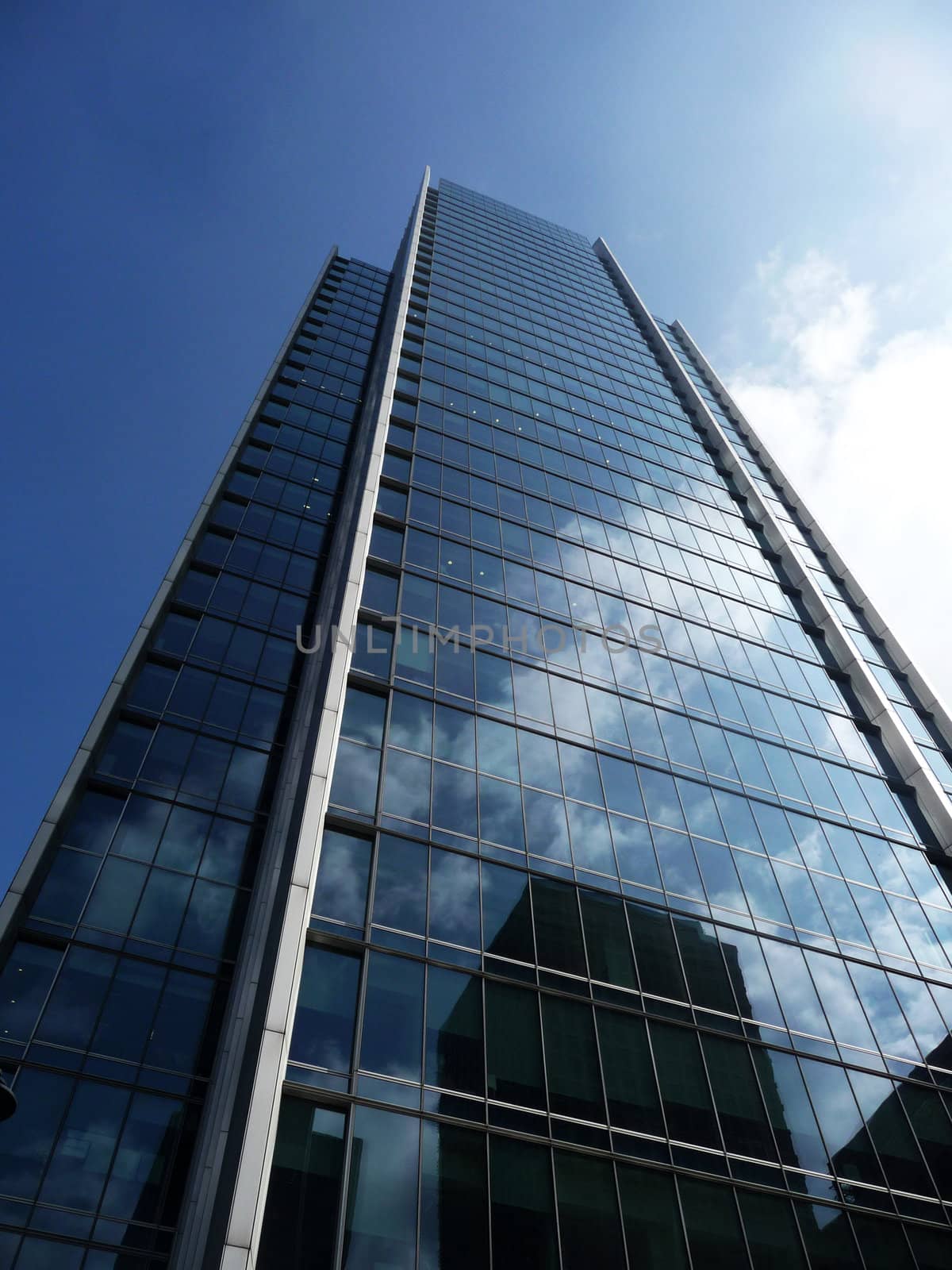 A shiny glass building in Londons Docklands.