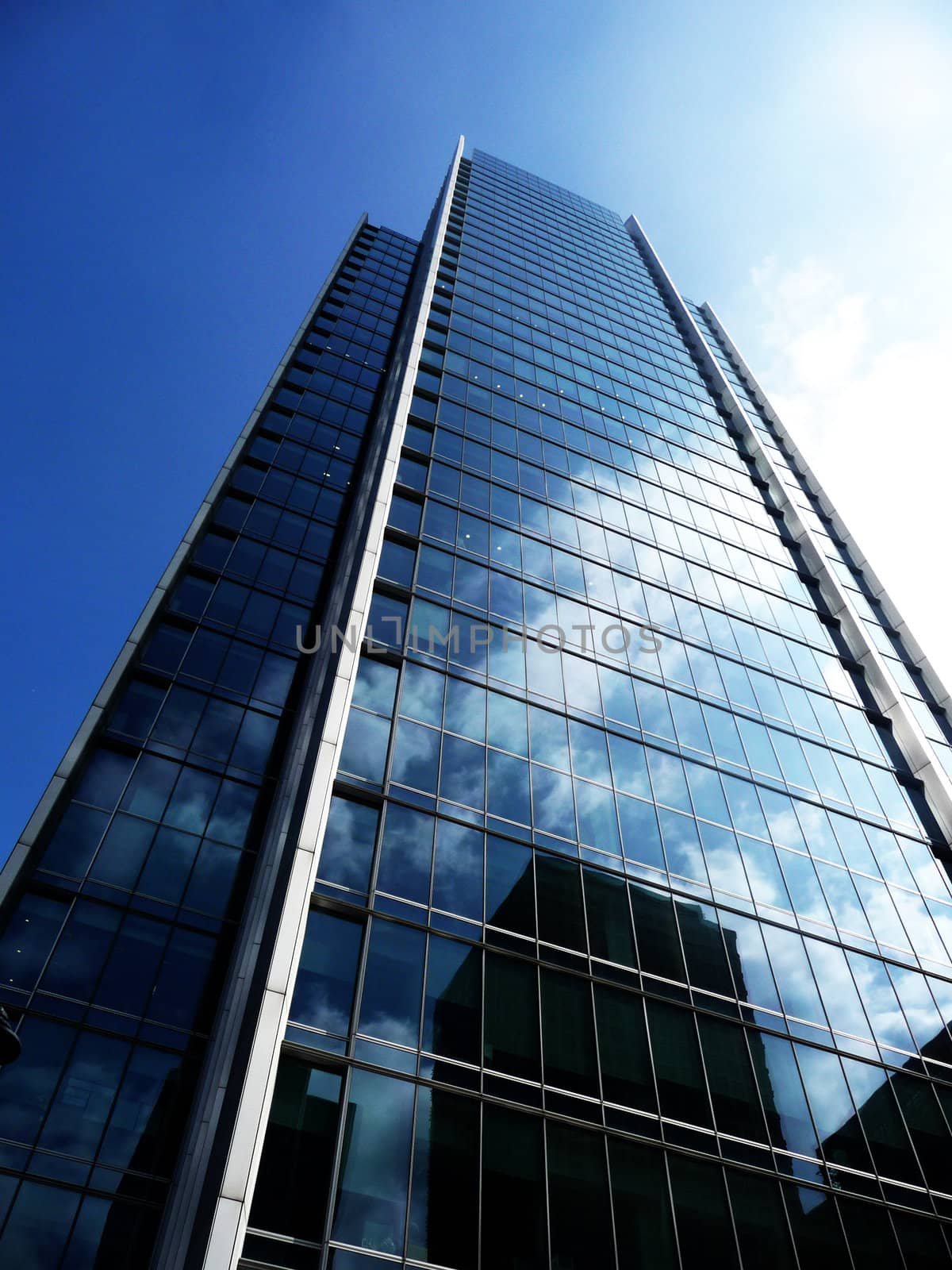 A shiny glass building in Londons Docklands.