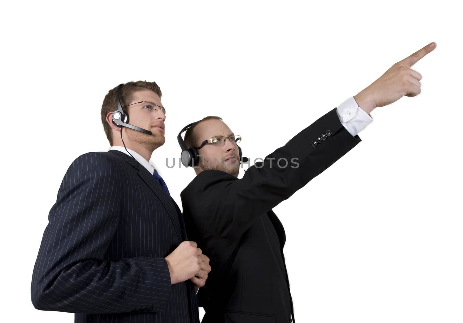 handsome businessman pointing in front on white background