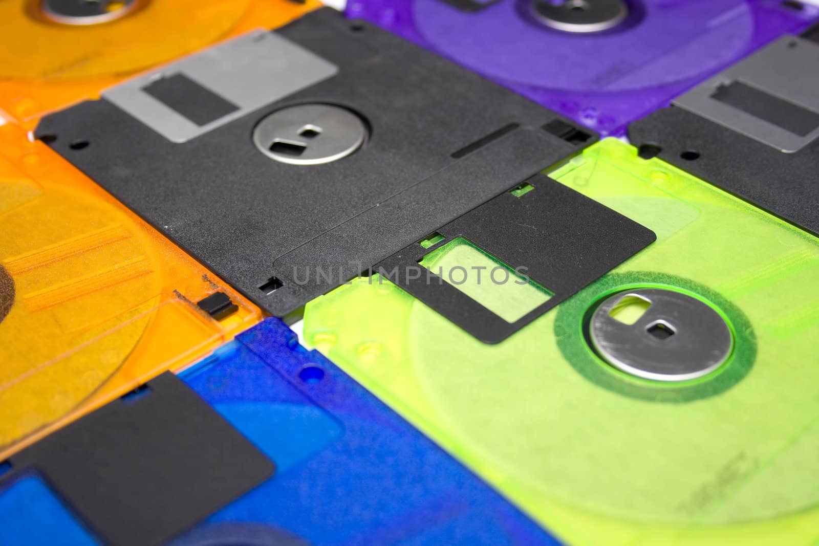 Background consisting of several diskettes of different color. Shallow DOF