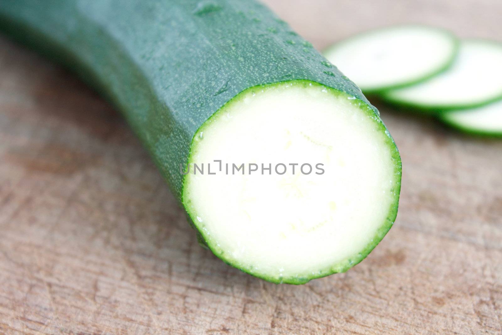 Courgettes on a wooden background