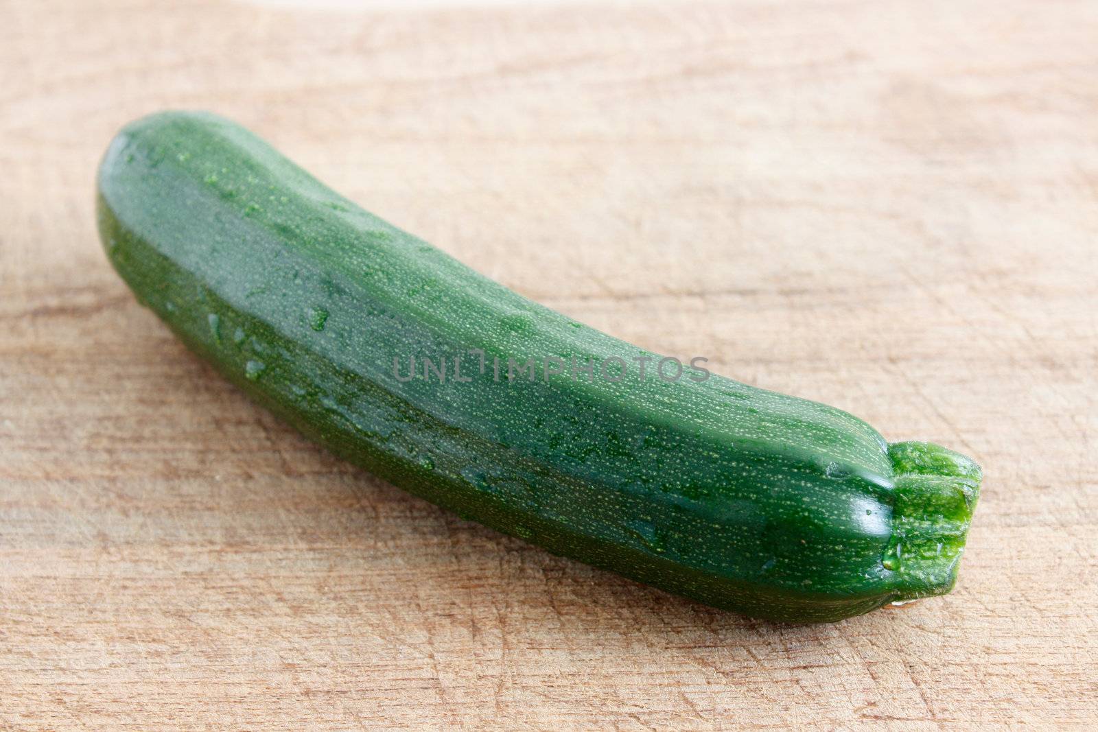 Courgettes on a wooden background