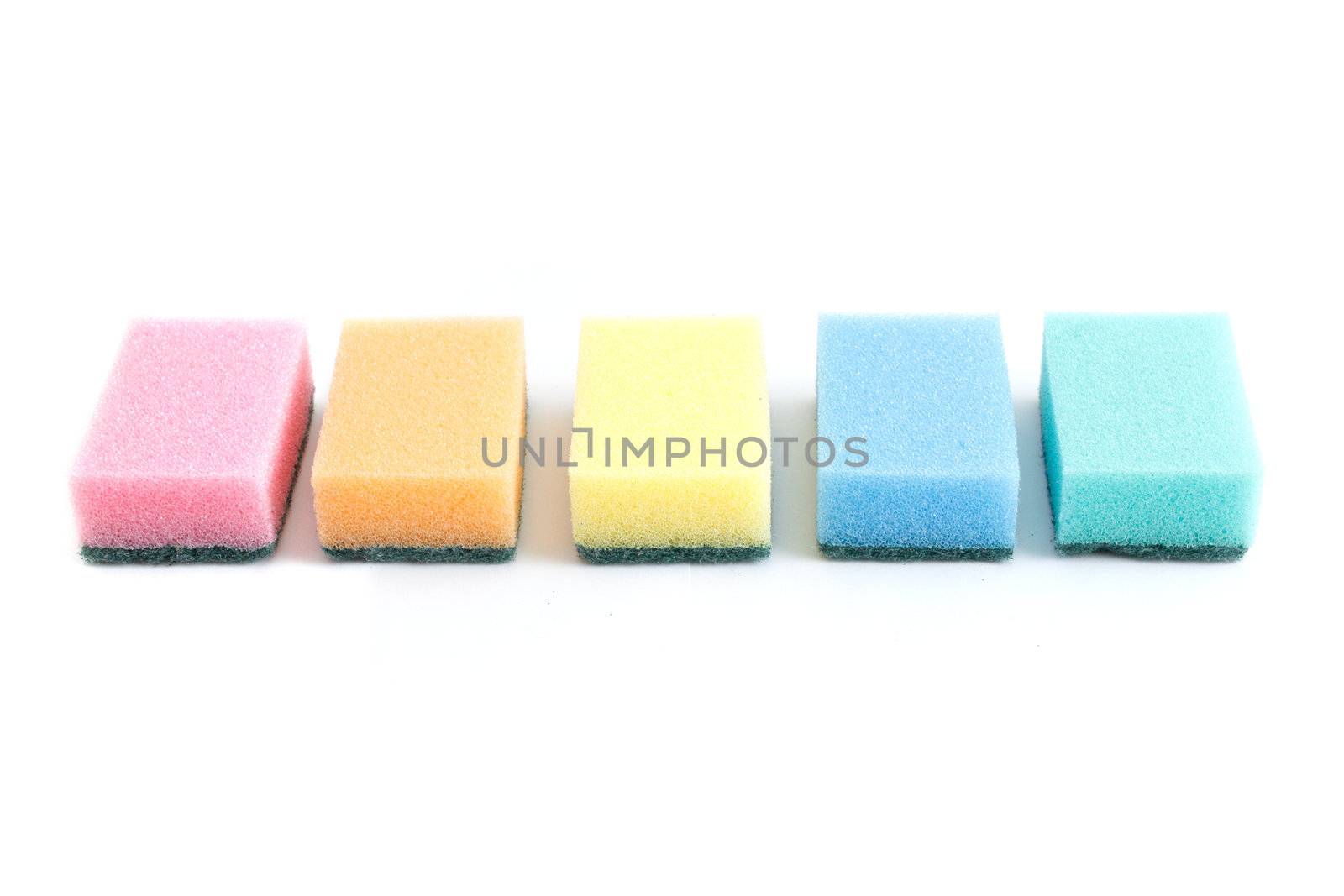 Colourful sponges isolated on a white bg