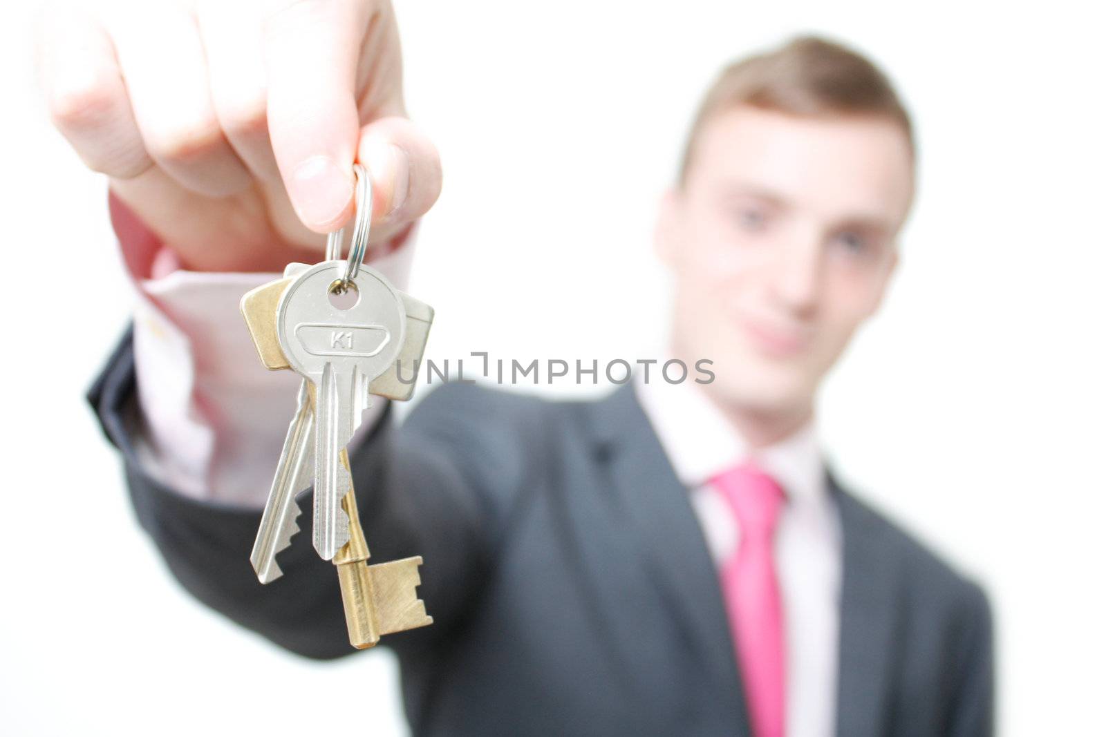 A business man giving you the keys to a home