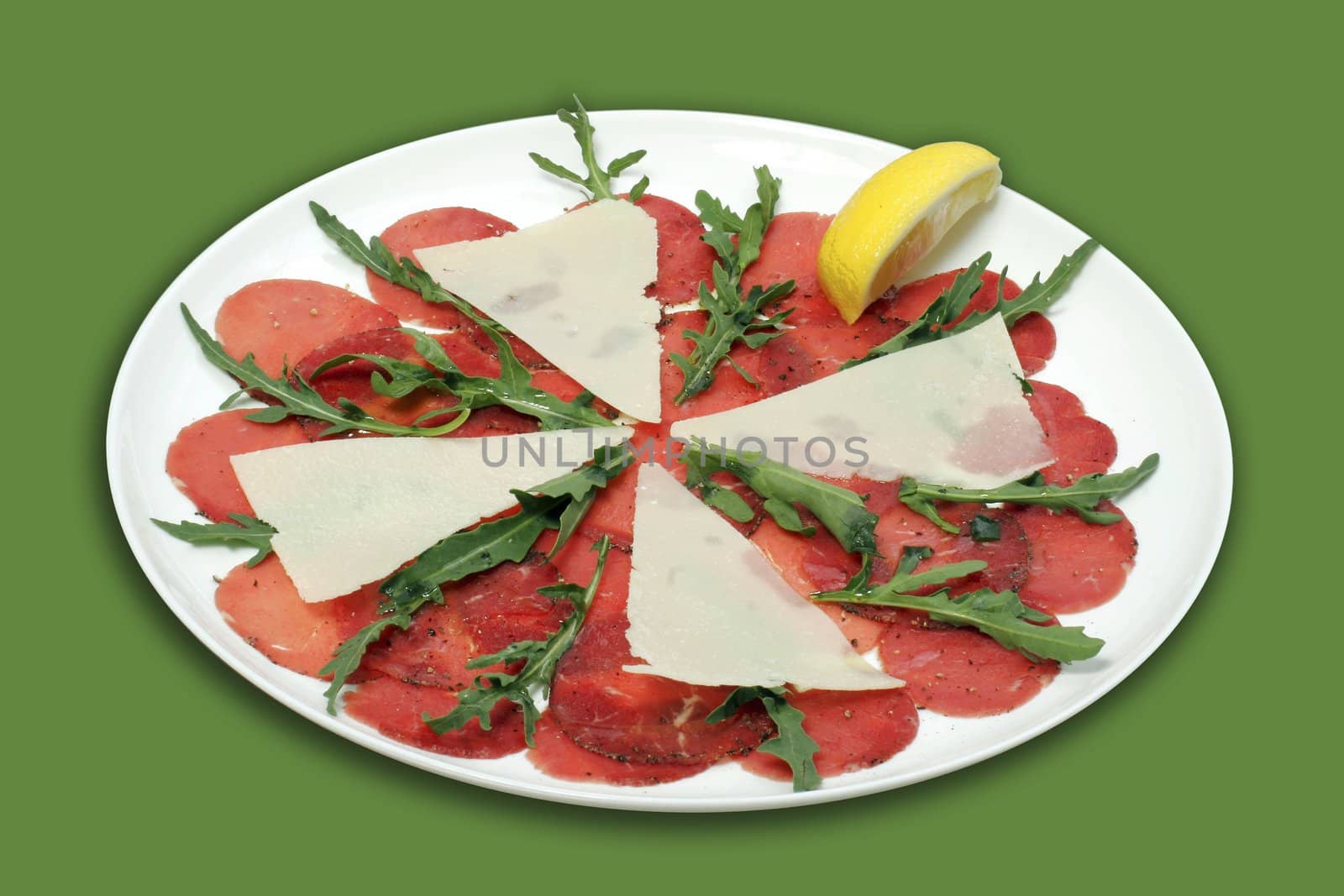 Cold snack - Beef carpaccio with parmesan cheese. 